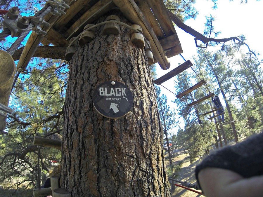Sign pointing to the most difficult course at Flagstaff Extreme - the black course.
