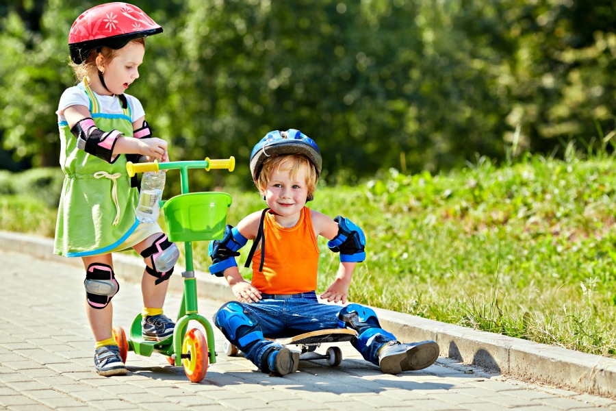 Kids with gear riding scooters is one way to practice holiday safety