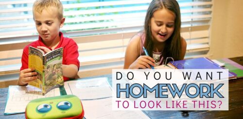 Two elementary school kids happily work on homework